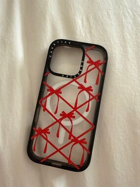 Casetify Black Clear Case with Red Bow Grid Design- iPhone 16 pro